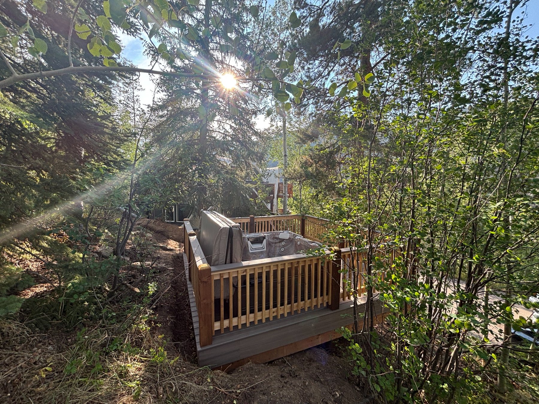 Outdoor hot tub among the trees